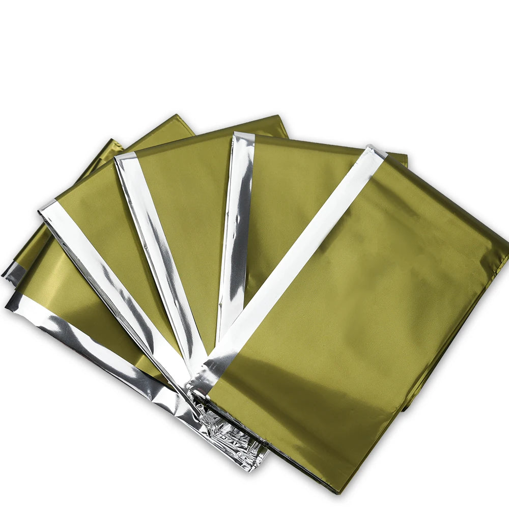 Couverture de survie thermique double face argent et or pour protection contre le froid et la chaleur en extérieur